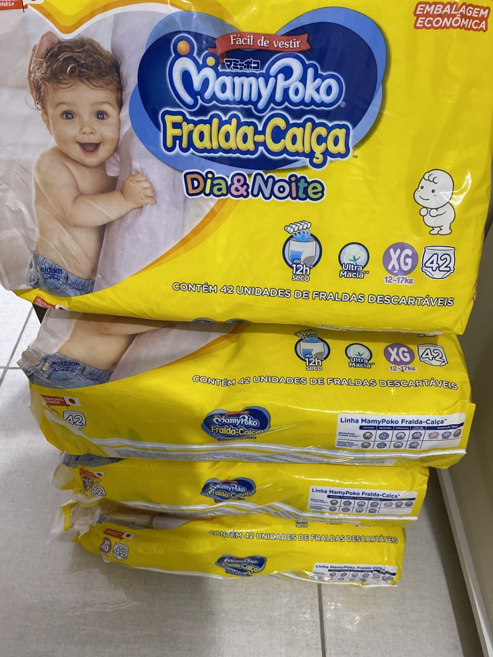 Kit com 4 pacotes - Fralda-Calça MamyPoko Dia & Noite M G XG e XXG