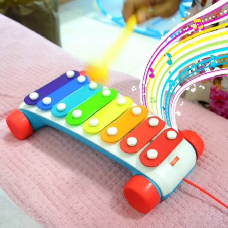 Fisher Price puxando e tocando xilofone
