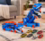Caminhão Dinossauro Pista de Carrinho Infantil Maleta para 18 Carrinhos